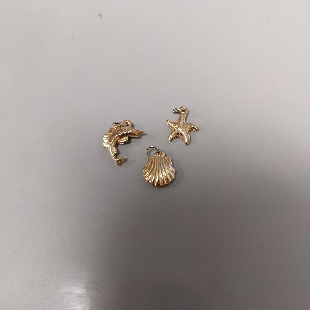 Various gold colored ocean themed pendants (set of 3)